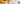 Gold jewelry with a blurred background of dollar bills