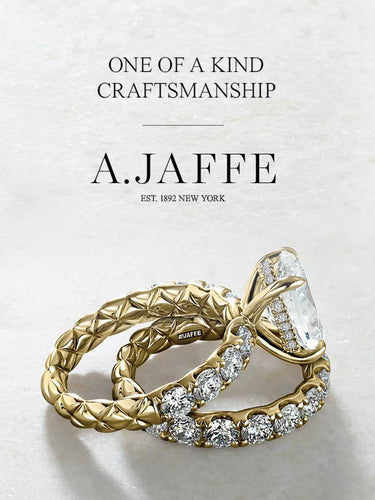Gold and diamond ring with 'A. Jaffe' branding on a light background