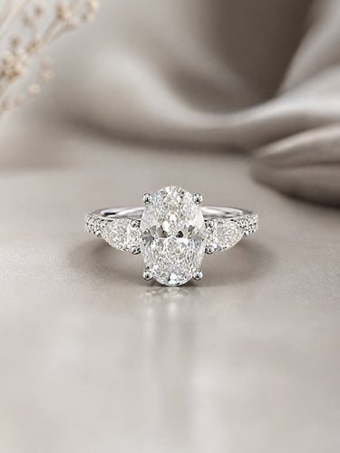 Diamond ring on a soft beige fabric background