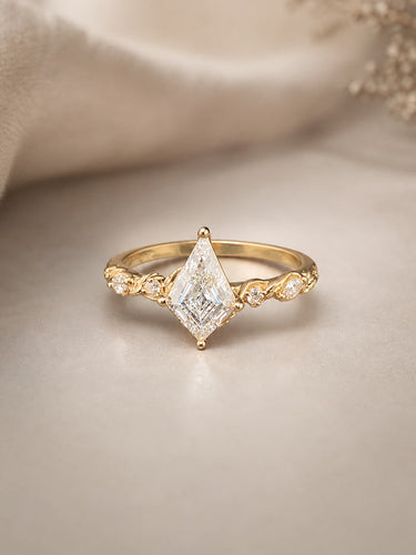 Gold ring with a diamond on a beige background