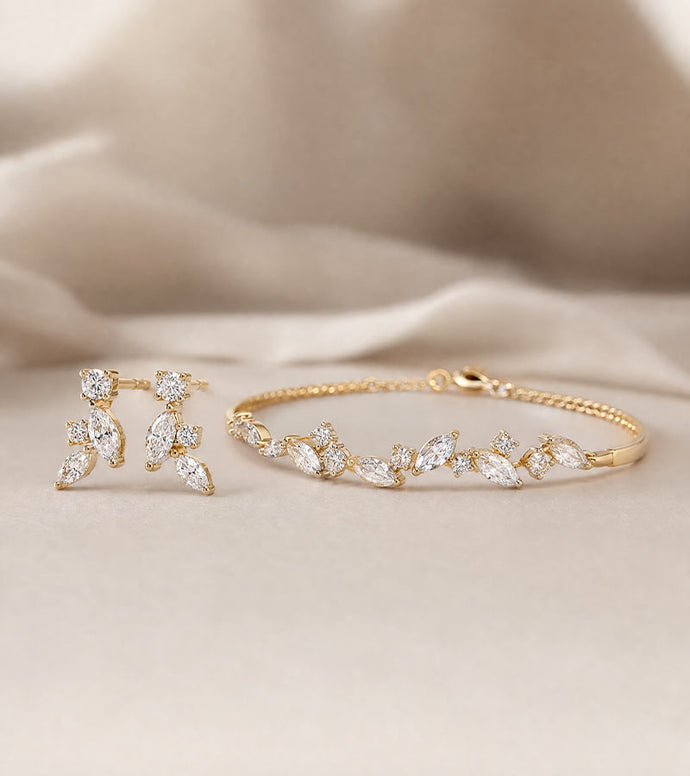 gold earring and bracelet with diamonds